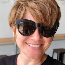 person with sunglasses smiling